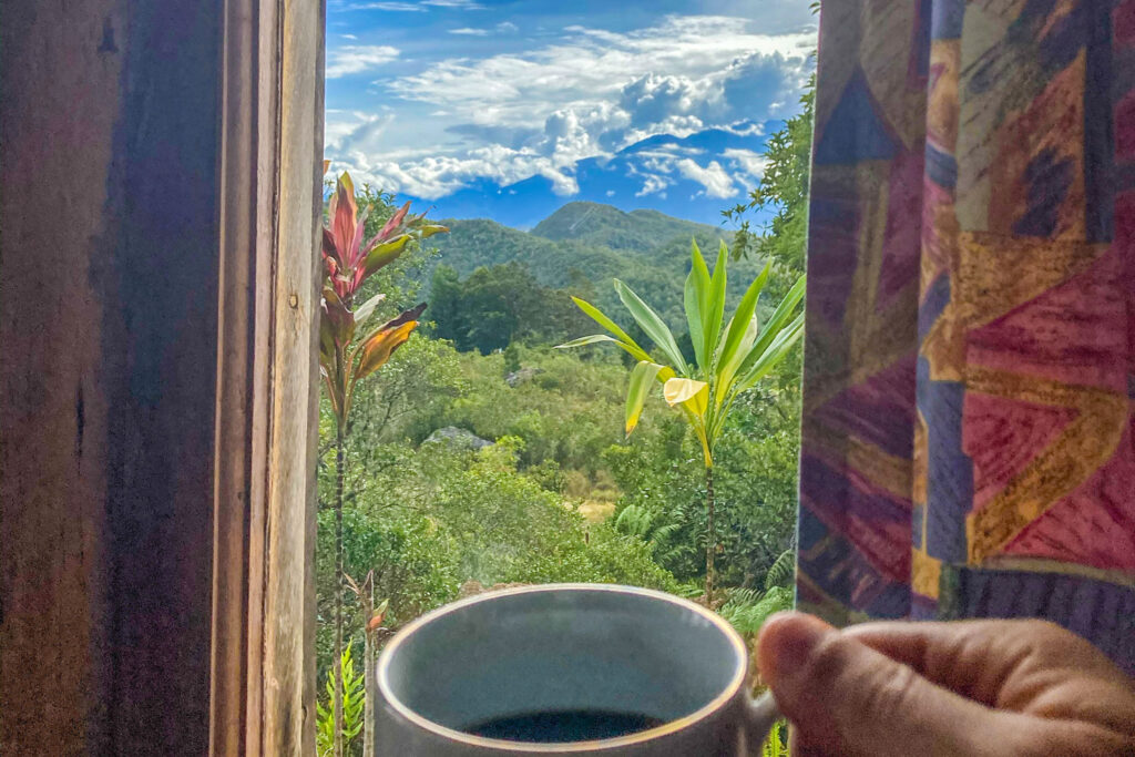 Having a cup of coffee in The Baliem Valley Resort bungalow